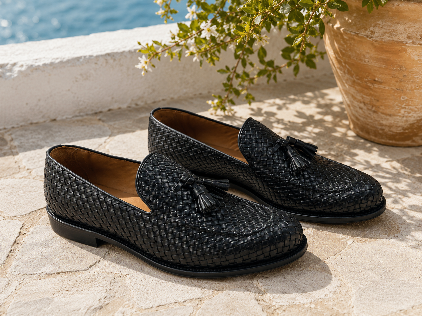 Slipper nero in pelle intrecciata