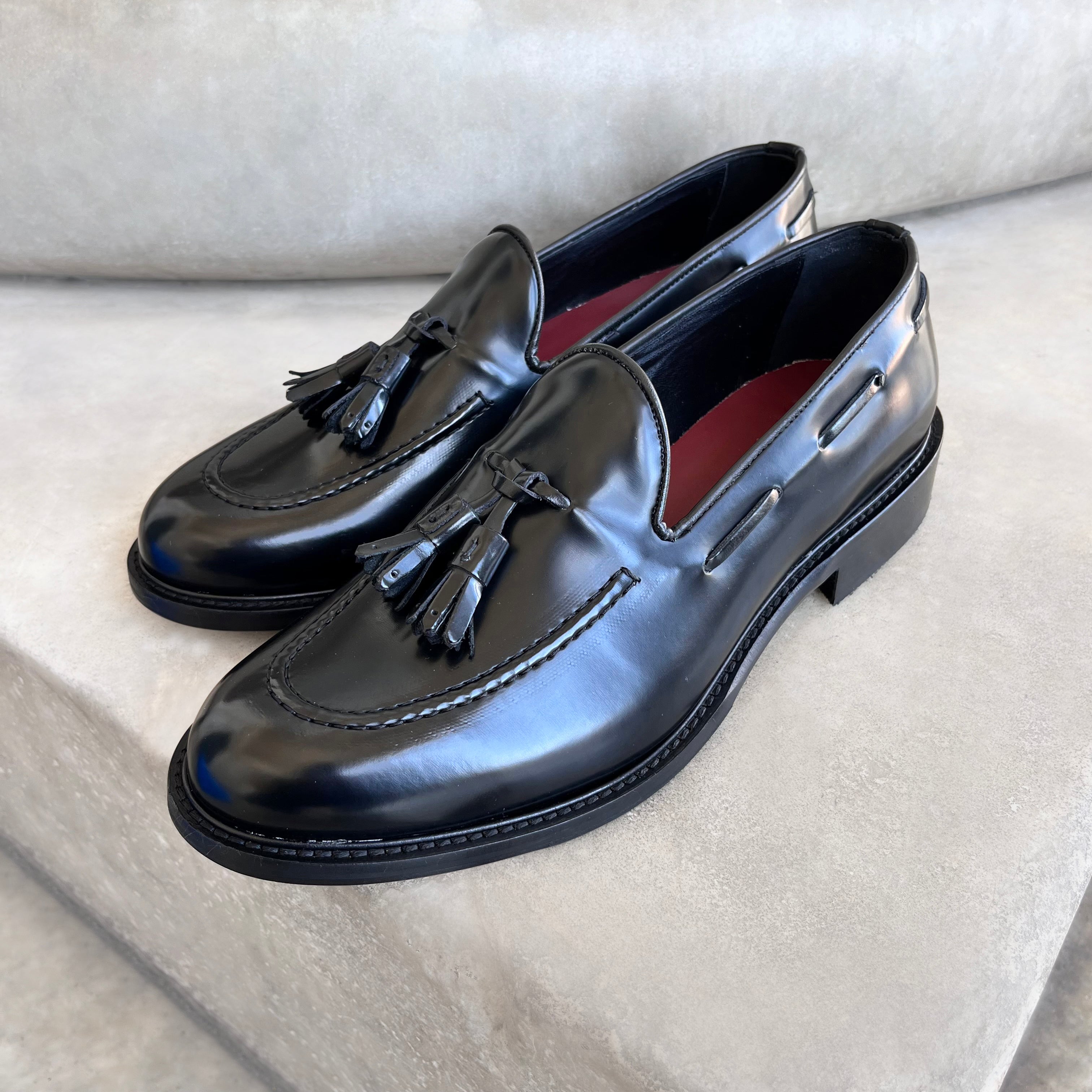 Black polished leather slippers