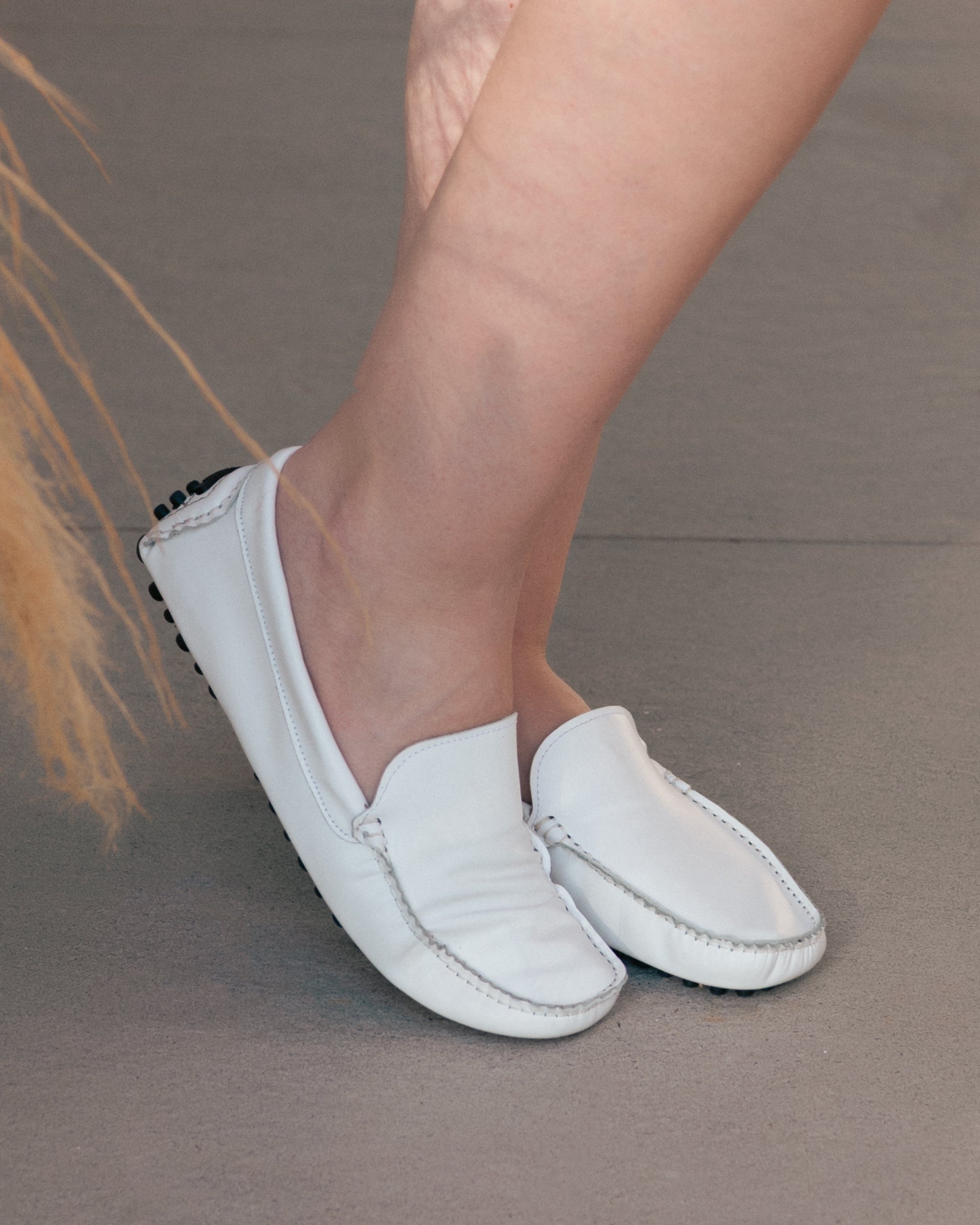 White leather loafers