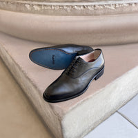 Black leather brogues